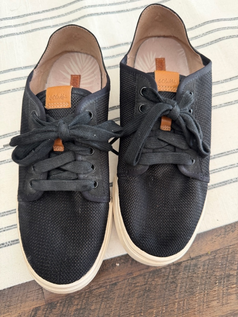 OluKai Black Sneakers with Cream Sole and Tan Leather Tabs
